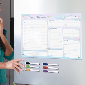 Close-up of magnetic acrylic daily planner on fridge with six colorful markers