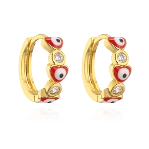 Detailed macro view of gold-plated evil eye hoop earrings with red heart enamel and zircons