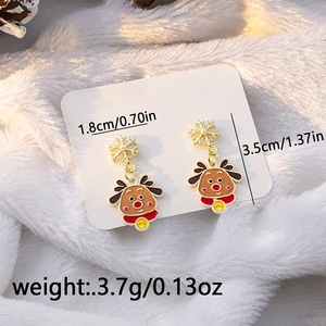 Detailed macro shot of Christmas reindeer and snowflake earrings with size measurements