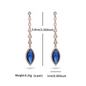 Detail view of blue zircon earrings with rose gold frame and size measurement