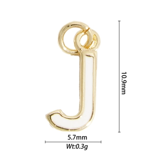 Detailed view of gold letter J pendant with white enamel, size 10.9mm by 5.7mm and 0.3g