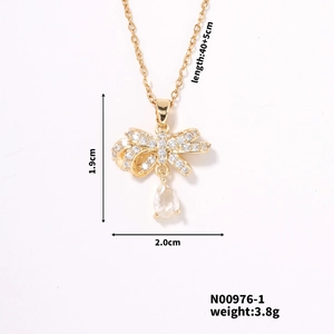Detailed dimensions of gold bow ribbon necklace with clear teardrop zircon pendant