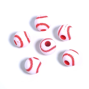 Detailed macro view of white acrylic baseball beads with red stitching for DIY jewelry