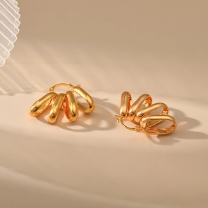 Minimalist multi-layer 18K gold plated hoop earrings with professional soft lighting