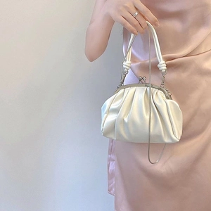 Chic pleated cloud clutch bag in creamy white leather with chain strap and knotted handle