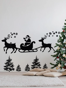 Détail de stickers muraux silhouette Père Noël et rennes dans une chambre de Noël