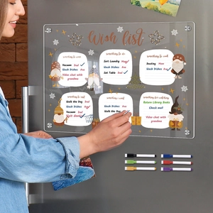 Macro view of magnetic acrylic weekly planner with Christmas gnome and wish list on fridge