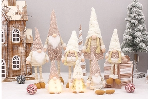 Close-up of Nordic Christmas gnomes with telescopic legs and glowing plush fabric details