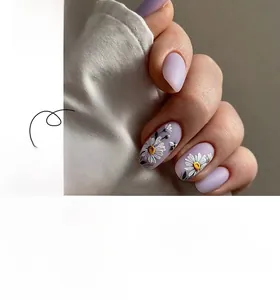 Detail of short round purple press-on nails featuring daisy and bee designs