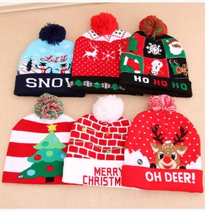 Detail of colorful LED Christmas knit hats with assorted patterns and ON/OFF switches