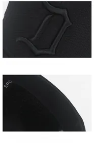 Detailed close-up of the black baseball cap featuring 3D embroidered D letter and back strap