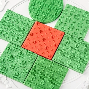 3D Christmas cookie stamp set with snowflake, tree, and gingerbread man embossed patterns