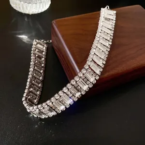 Luxurious wide choker necklace with mixed-cut rhinestones on a silver polished base