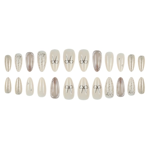 Silver 3D bow almond press-on nails with beige glitter and pearl accents on white background