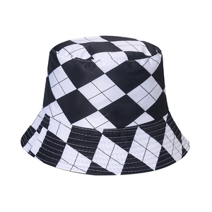 Classic black and white checkerboard pattern cotton bucket hat for women on white background