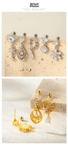 Detailed tile display of gold and silver floral cartilage studs with cubic zirconia