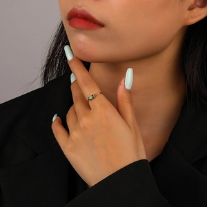 Minimalist 925 sterling silver ring featuring a rectangular green gemstone on a slim gold band