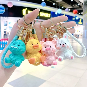 Set of 4 cute cartoon resin animal keychains featuring dinosaur, duck, pig, and rabbit.