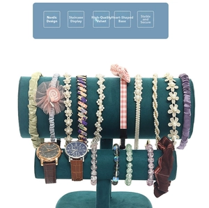 Close-up of emerald green velvet double-tier T-bar jewelry stand with heart base