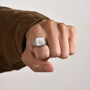 Silver stainless steel ring for men featuring an octagon white stone inlay worn on hand