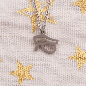 Detailed close-up of a silver stainless steel necklace with Eye of Horus pendant