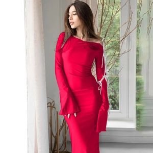 Detail of red long sleeve dress featuring stylish white lace-up ties on the sleeves