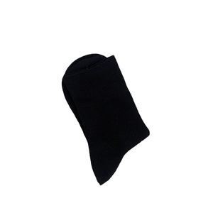 Mid-calf length black cotton crew socks with soft ribbed cuffs on plain white background