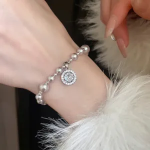 Elegant gray pearl bracelet with a sparkling cubic zirconia circular charm for women