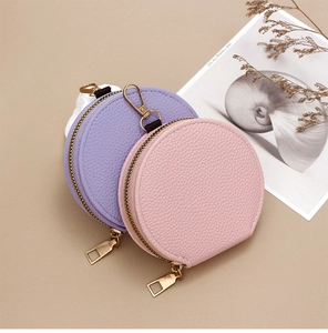 Litchi pattern PU leather mini round coin purses in pink and purple with golden zipper