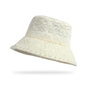 Breathable cream lace bucket hat with pearl trim and elegant floral cutout pattern