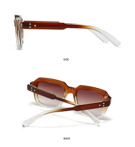 Detail view showing the brown gradient frame and star-shaped metal rivets of these sunglasses