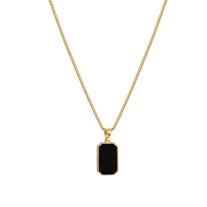 Minimalist gold chain necklace featuring a geometric black rectangular pendant on white backdrop