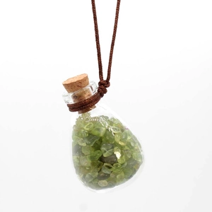 Glass pendant perfume bottle with green crystal stones and brown braided rope