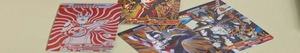 Close-up of Ultraman trading cards with detailed character graphics and stats