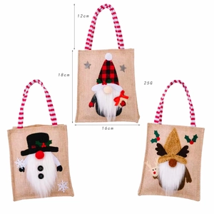 Three Christmas burlap gift bags with gnomes and detailed size specs on white background