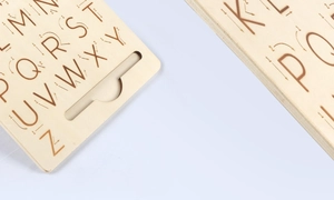 Macro detail of wooden alphabet tracing board with guided arrows for children learning