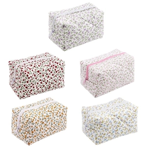 Quilted cotton makeup bags set in five floral patterns with secure zipper closure