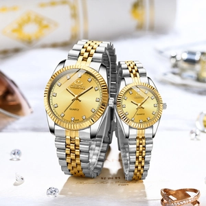 Detail of CHENXI gold and silver quartz watches with diamond markers and fluted bezel