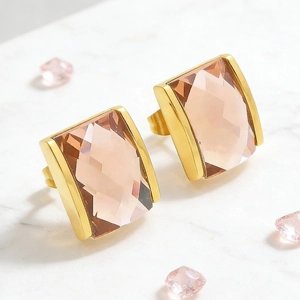 Detail of elegant rectangular pink crystal earrings with 18K gold plated metal frame