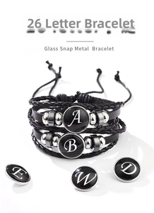 Detail of multi-layer braided leather bracelet with interchangeable letter glass snaps