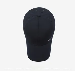 Top view of breathable laser-cut vents and six-panel structure on a navy baseball cap