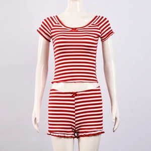 Close-up of red and white striped crop top and shorts set with red bow accents