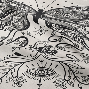 Close-up of Bohemian tapestry fabric showing butterfly pattern and linen texture