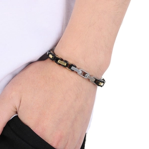 Close-up of a 6mm tri-color stainless steel chain bracelet on a male wrist