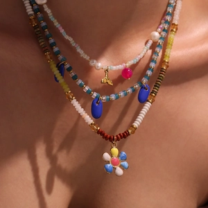 Bohemian multilayered necklace set with natural stones, pearls and floral pendants