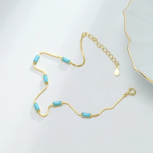 Detailed close-up of S925 sterling silver gold bracelet with rectangular blue stones