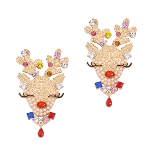 Christmas reindeer earrings with colorful rhinestones and pearls on white background