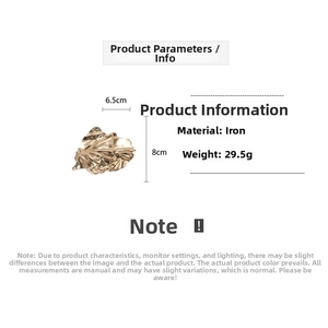Detailed view of golden textured leaf brooch with dimensions 6.5cm by 8cm and 29.5g weight
