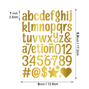 Macro shot of 1-inch gold alphabet and number stickers for DIY crafts and tumblers