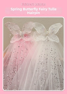 Detailed embroidery on butterfly hairpins with pearls and flowing sequin tulle fabric